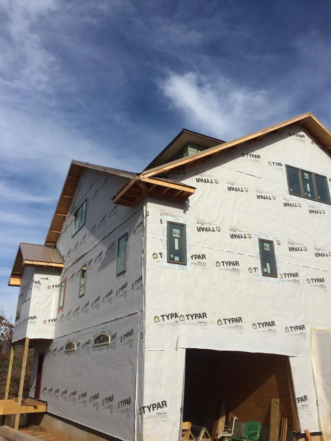 Stick built house wrapped in Typar with new roof framing and dormers in Crescent City